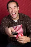 6419259-popcorn-man-watching-tv.webp
